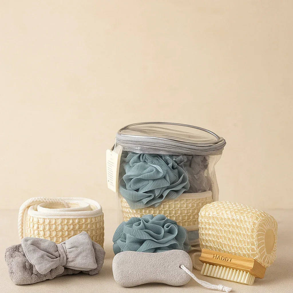 Clear bag with blue bath poufs, exfoliating back scrubbers, headband, and body brush set