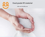 Hands holding white food grade PP plastic pellets over white background