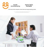 Office scene with two colleagues discussing papers at desk with portable electric lunch box
