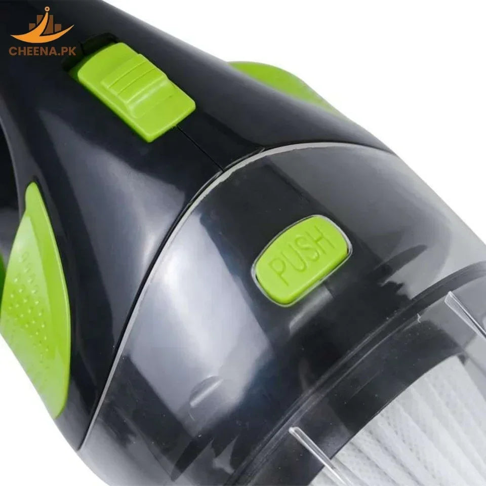Close-up of black and green handheld vacuum cleaner with push button and brand logo