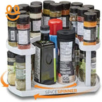 White rotating spice spinner rack holding various spice jars and bottles against white background
