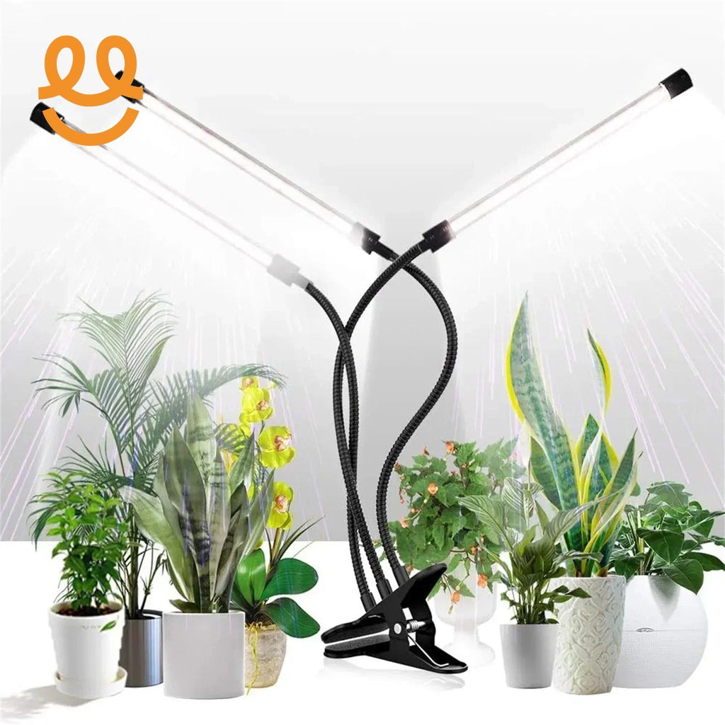 Dual clip-on LED grow lights with flexible arms illuminating indoor potted plants
