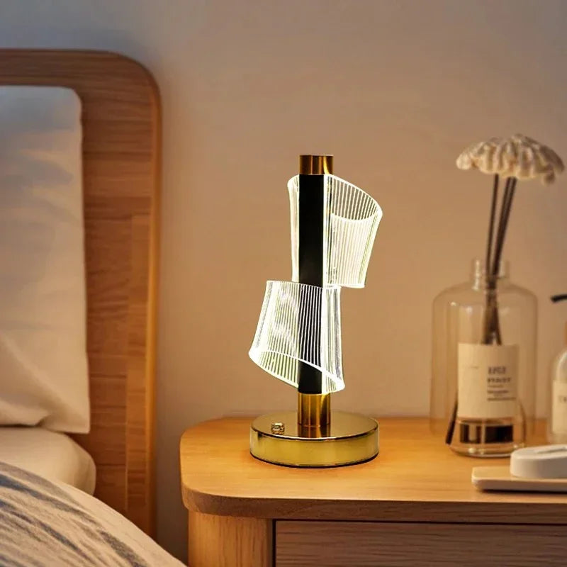 Modern LED bedside lamp with spiral acrylic design on wooden nightstand in cozy bedroom
