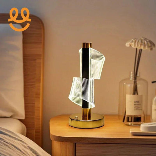 Modern LED bedside lamp with spiral acrylic design on wooden nightstand in cozy bedroom