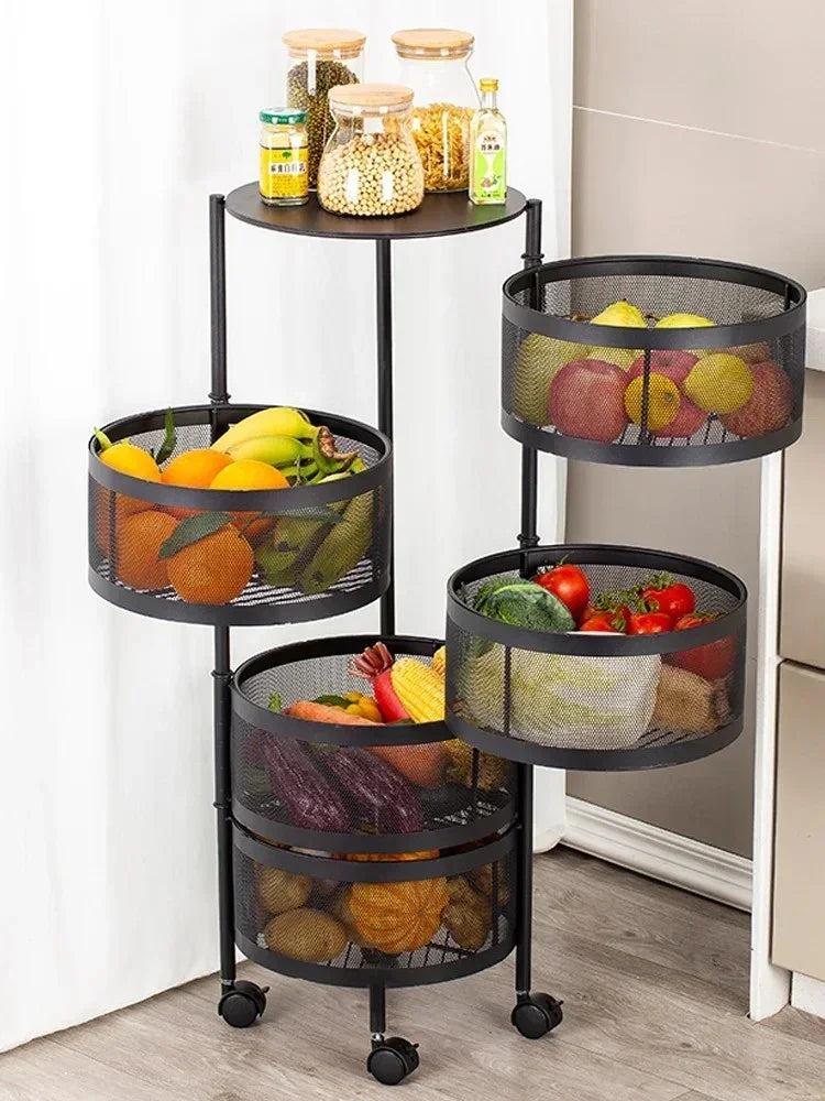 Black metal mesh tiered kitchen storage cart with fresh fruits, vegetables, and glass jars on wheels