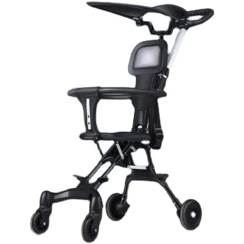 Compact black baby stroller with canopy, safety harness, and four wheels on white background