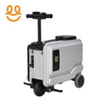 Silver electric ride-on suitcase with handlebar and three wheels for easy travel
