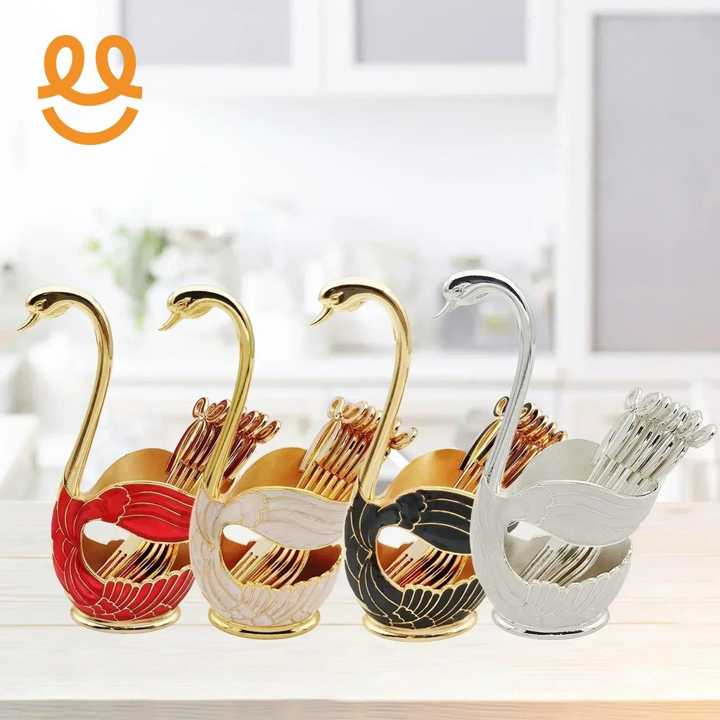 Elegant swan-shaped metal toothpick holders in red, white, black, and silver colors on kitchen counter