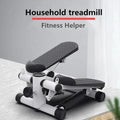 Compact household treadmill stepper with black textured pedals on a light wooden surface