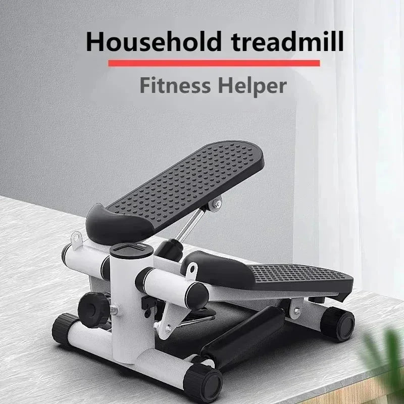 Compact household treadmill stepper with black textured pedals on a light wooden surface
