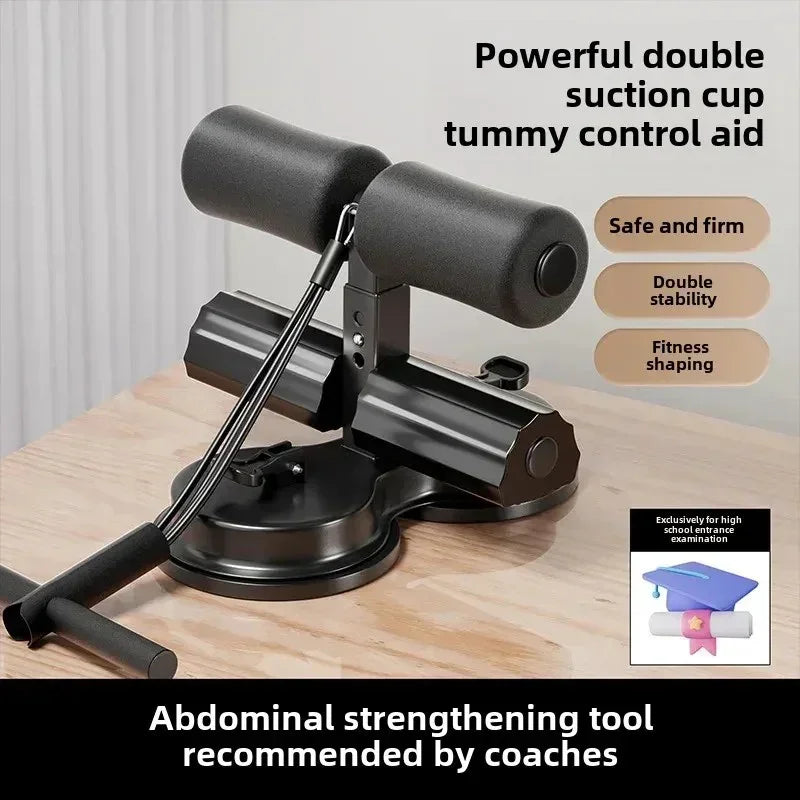 Black tummy control abdominal strengthening tool with double suction cups on wooden floor