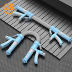 Two blue hand grip strengtheners with silver spring coils on a gray metal floor and platform
