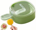 Green Ecoco silicone popsicle mold with lid and two handmade popsicles, one with strawberry inside