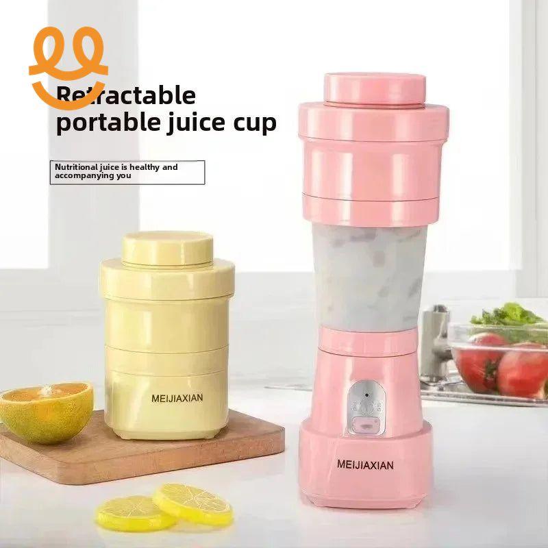 Retractable portable juice cups in pink and yellow on kitchen counter with lemon slices and half orange
