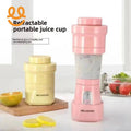 Retractable portable juice cups in pink and yellow on kitchen counter with lemon slices and half orange