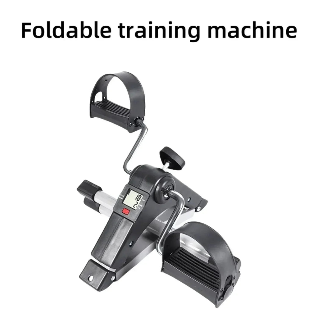Compact foldable black and silver pedal exerciser with digital display for home fitness training