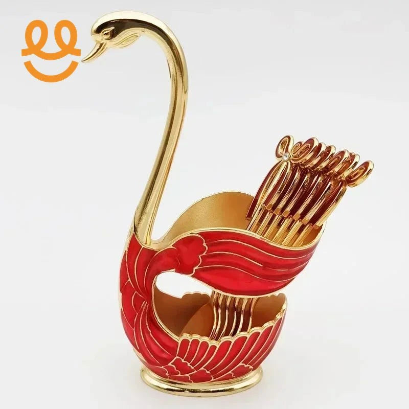 Elegant gold and red swan-shaped toothpick holder with decorative toothpicks