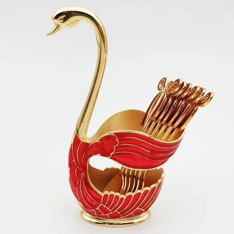 Elegant gold and red swan-shaped toothpick holder with decorative toothpicks
