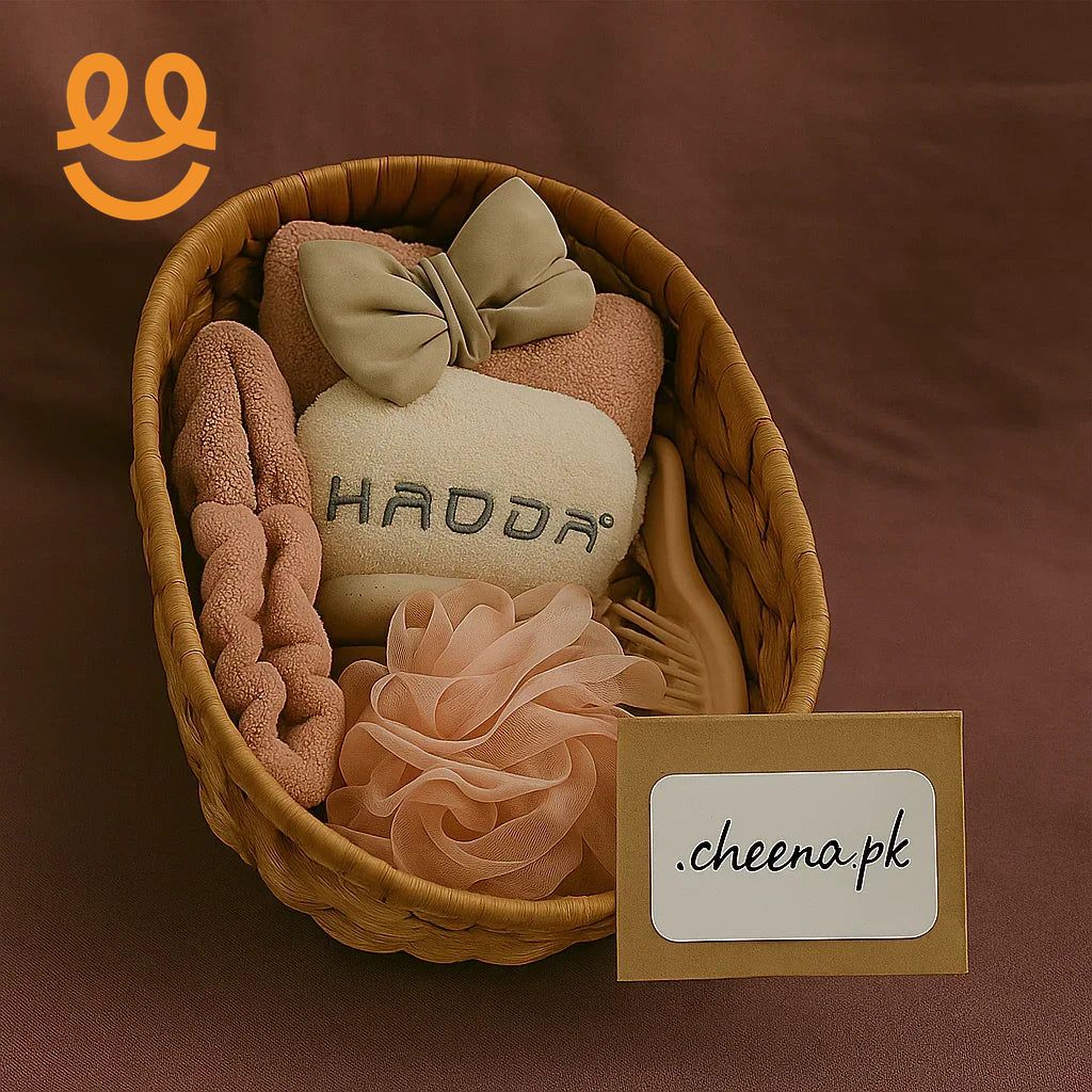 Wicker basket with beige bath accessories including a bow towel, comb, scrunchie, and sponge on brown background