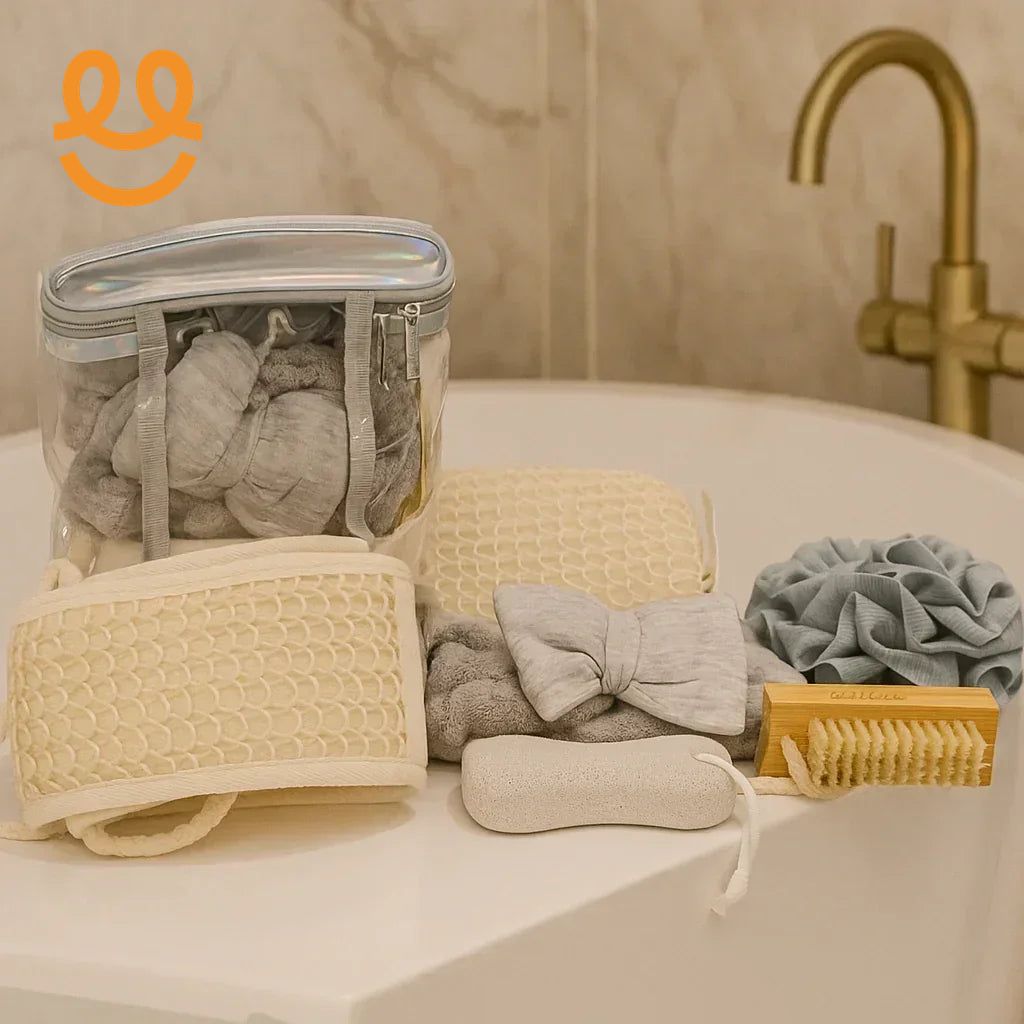 Spa essentials including bath mitts, exfoliating brushes, pumice stone, bath pouf, and headband on bathtub edge