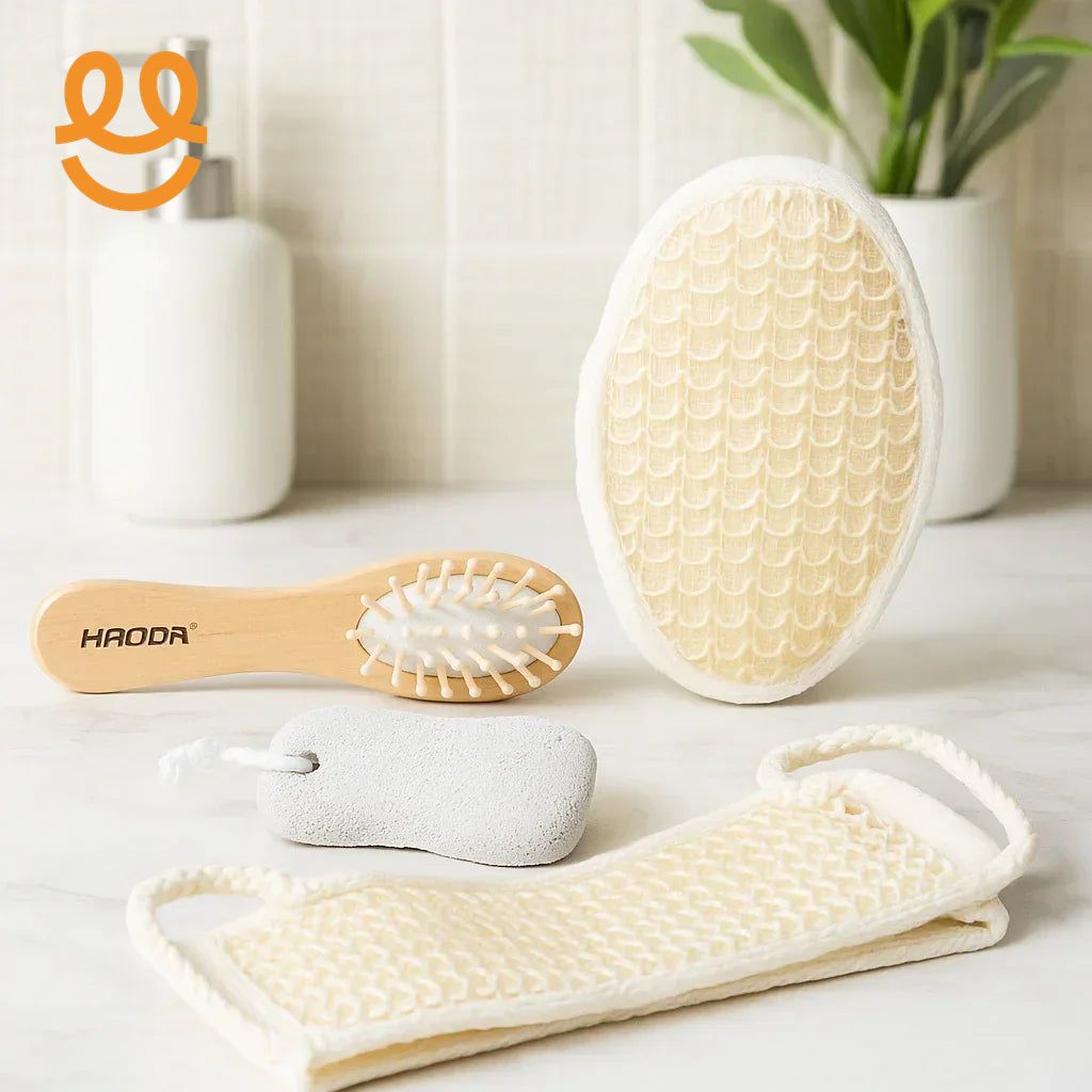 Eco-friendly bathroom essentials including wooden hairbrush, pumice stone, exfoliating mitt, and back scrubber on marble surface
