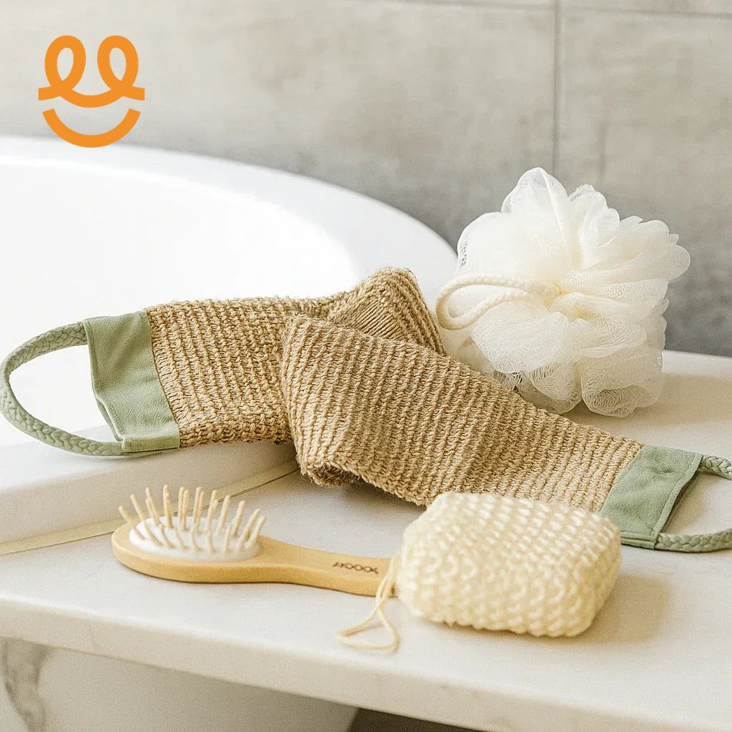 Bathroom accessories including natural fiber scrubber, wooden hairbrush, white bath sponge, and soap on tub edge