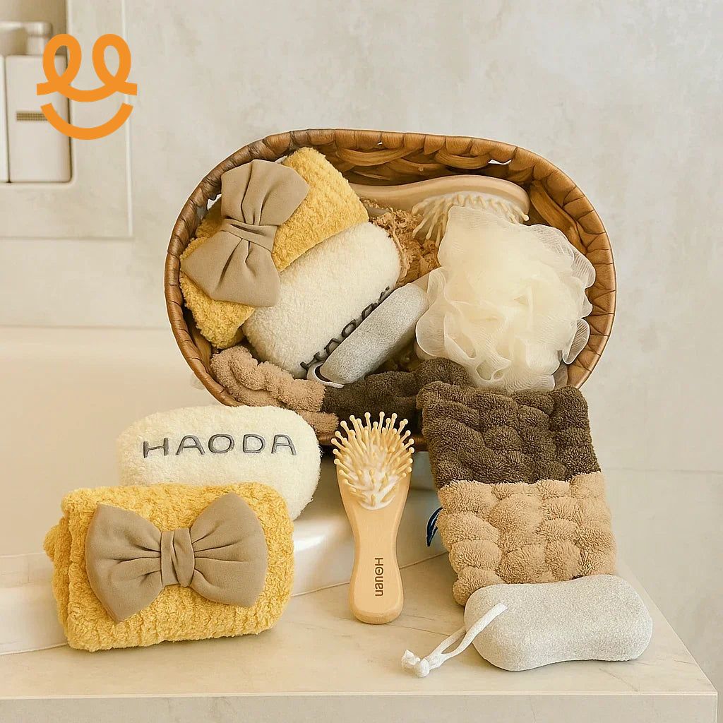 Aesthetic bathroom essentials including soft towels with bows, a wooden brush, sponge, and bath pouf in a woven basket