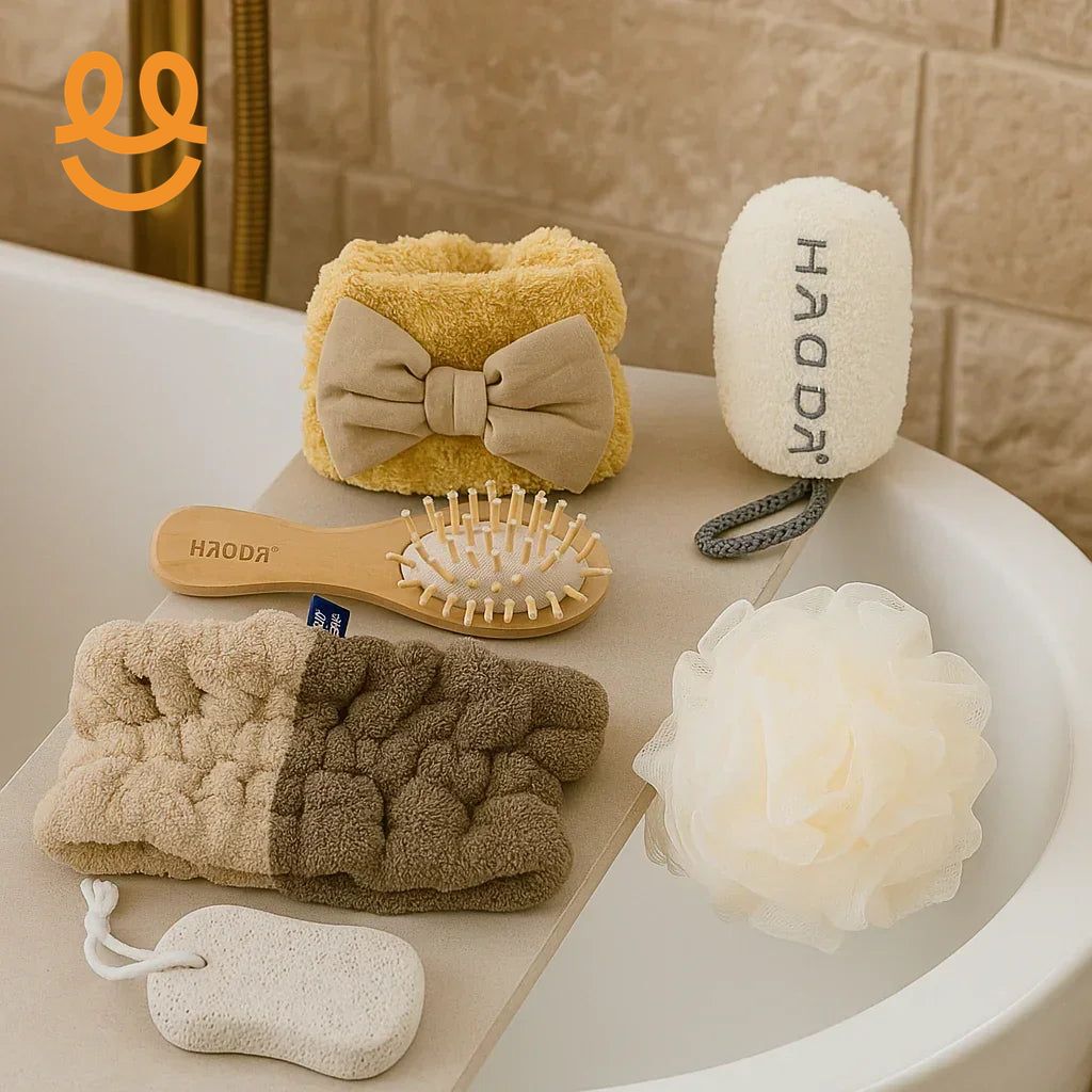 Cozy bath accessories including soft headbands, wooden hairbrush, pumice stone, loofah, and exfoliating sponge on bathtub edge