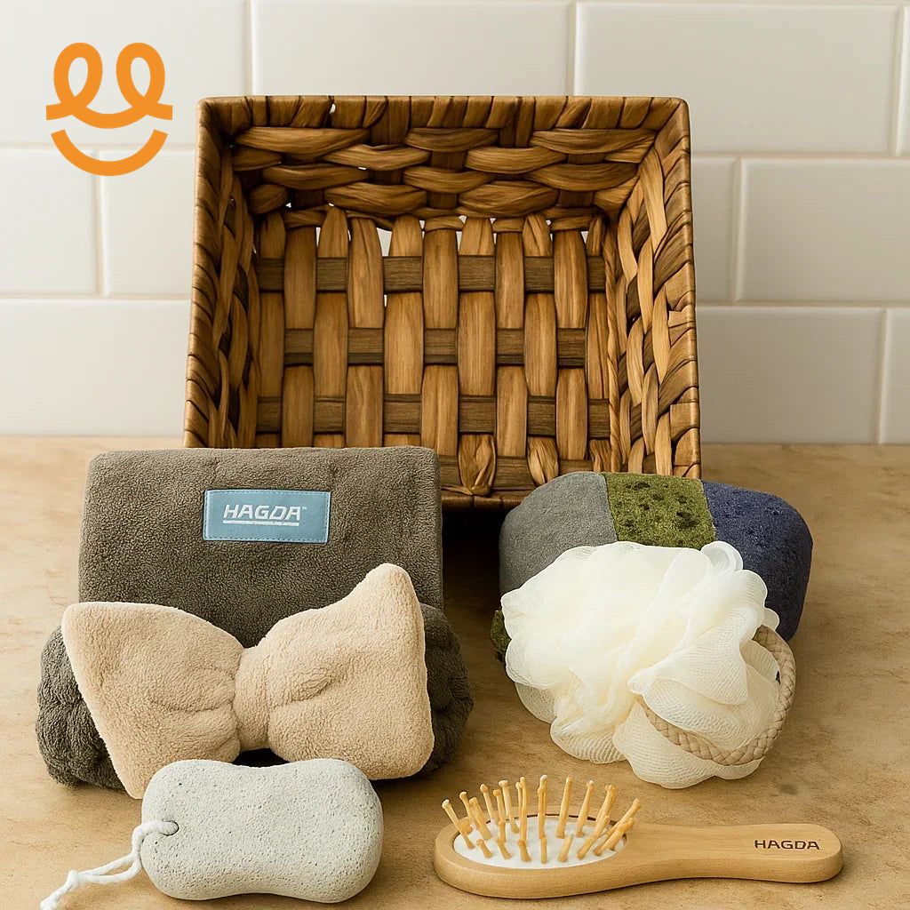 Bathroom essentials including woven basket, bath towel with bow, bath sponge, pumice stone, and wooden hairbrush on beige surface
