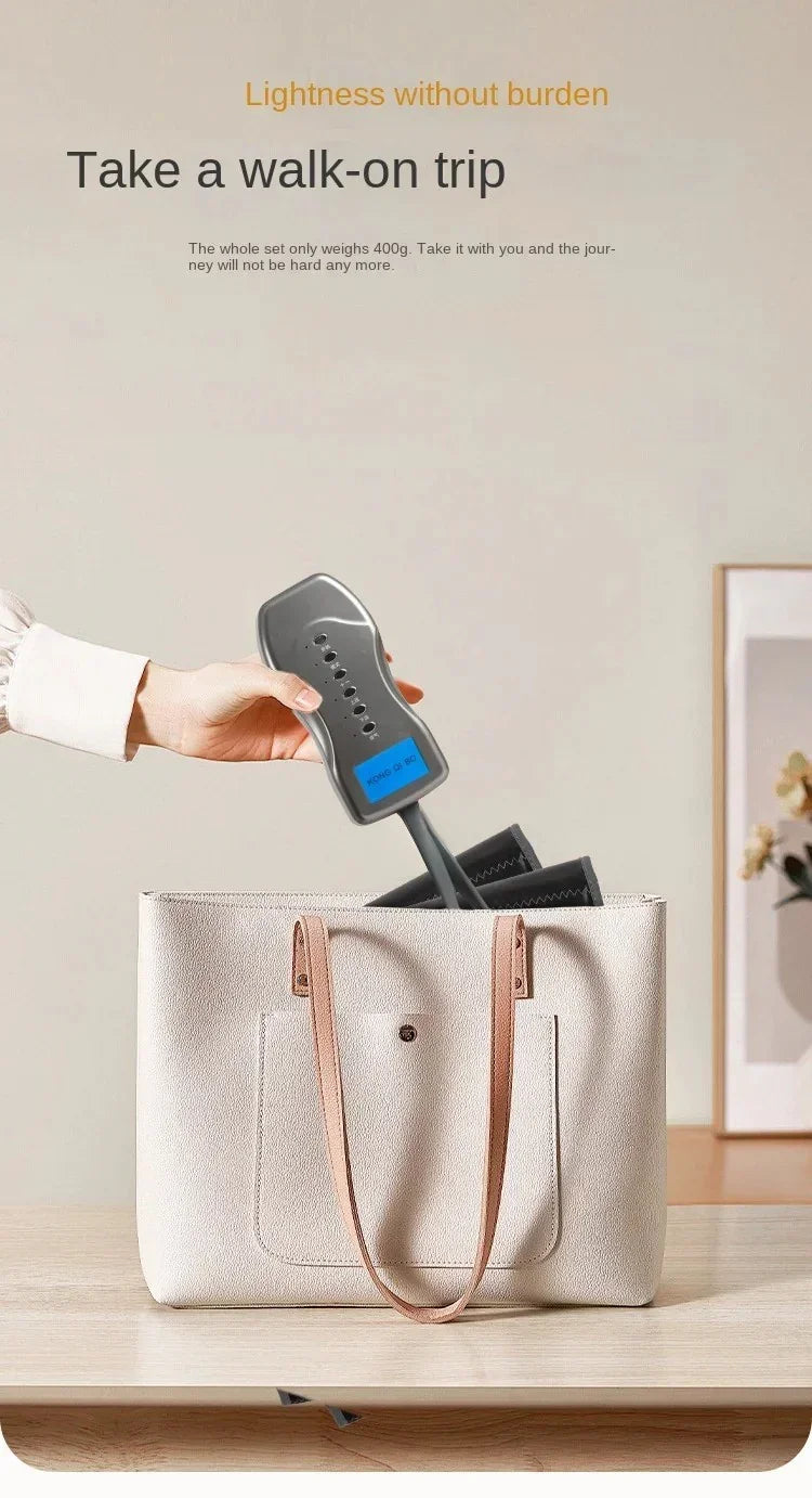 Hand placing compact black folding umbrella labeled Kong Ji PO into beige tote bag on wooden table