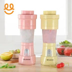 Pink and yellow Meijiaxian portable blenders on kitchen counter with fruits and vegetables nearby