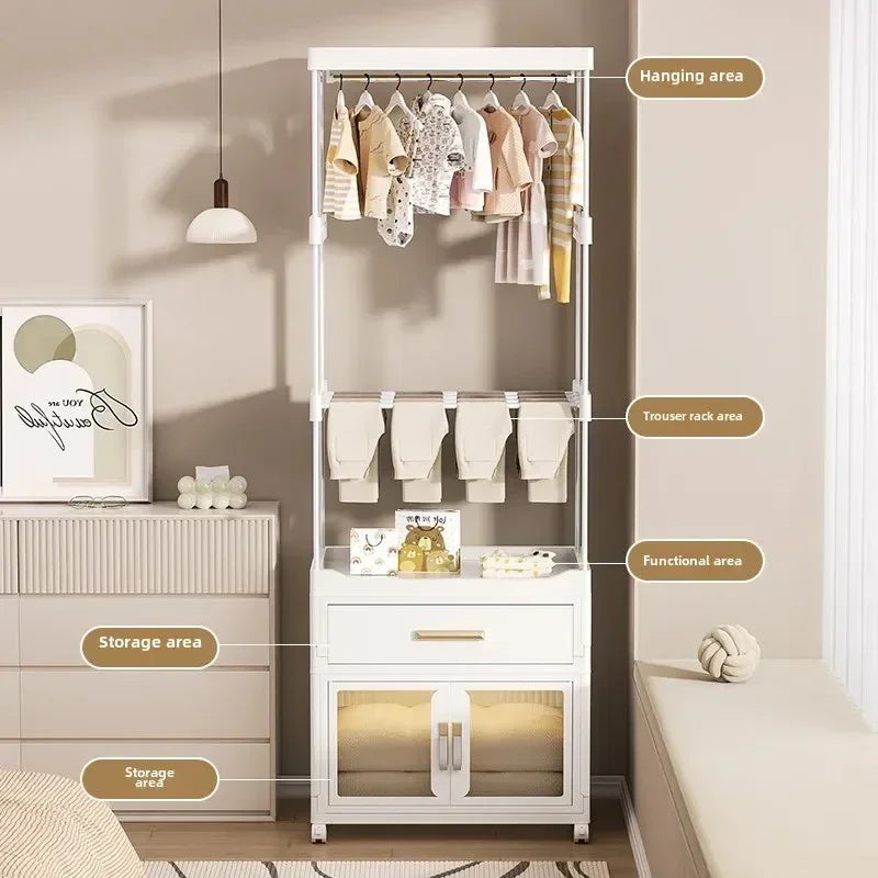 White multifunctional clothes rack with hanging area, trouser rack, drawer, and storage cabinet in beige bedroom