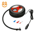 Compact round black and red portable air compressor with pressure gauge, hose, power cable, and three valve adapters