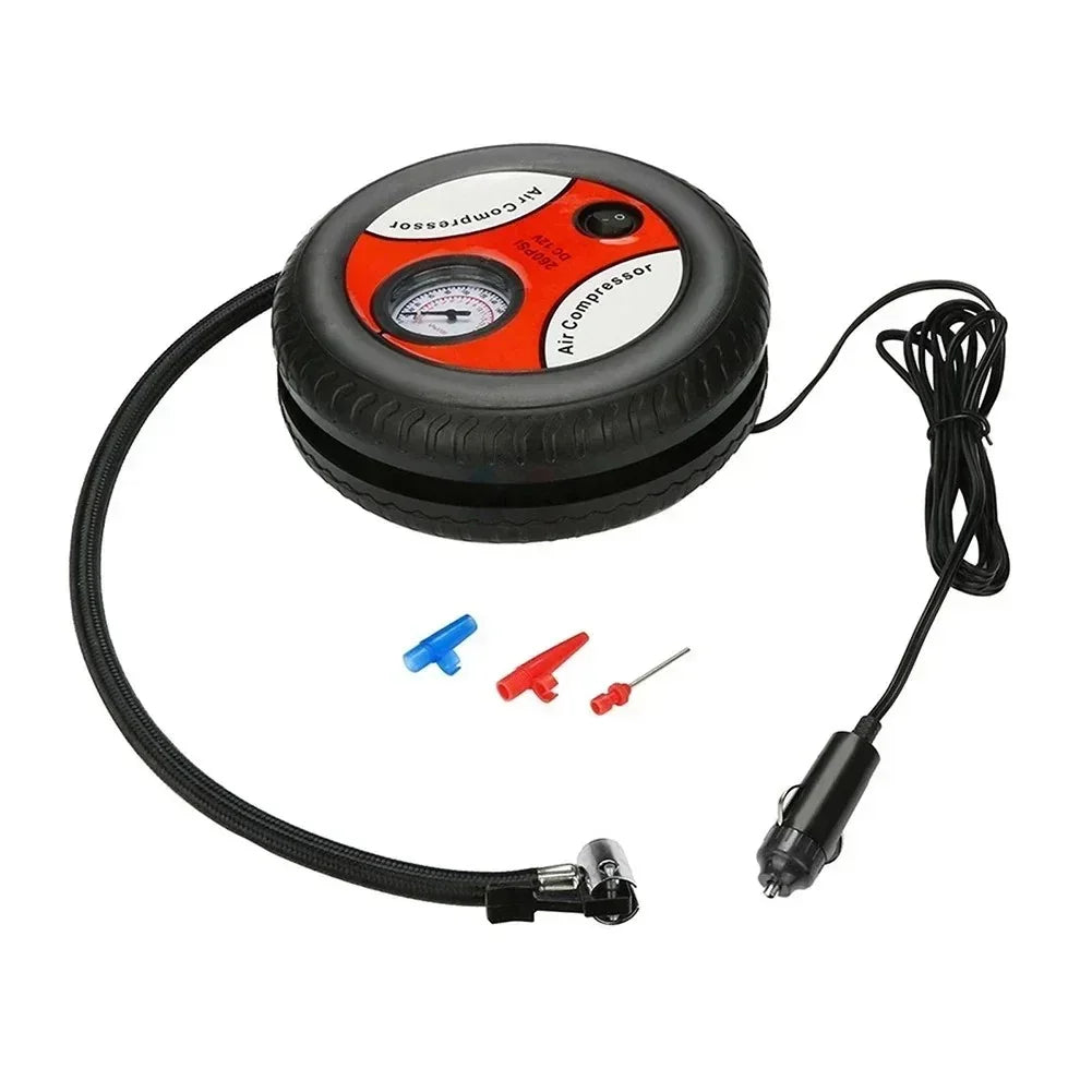 Compact round black and red portable air compressor with pressure gauge, hose, power cable, and three valve adapters