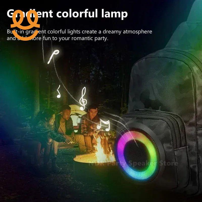 Outdoor campfire party with friends featuring a backpack Bluetooth speaker with colorful gradient lights