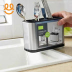 Hand holding stainless steel cutlery holder with spoons and forks draining water into kitchen sink
