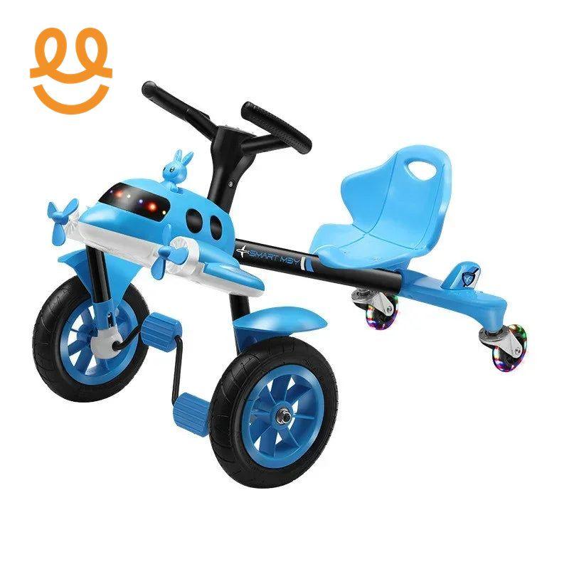 Blue airplane-themed kids tricycle with pedals, rear swivel caster wheels, and ergonomic seat