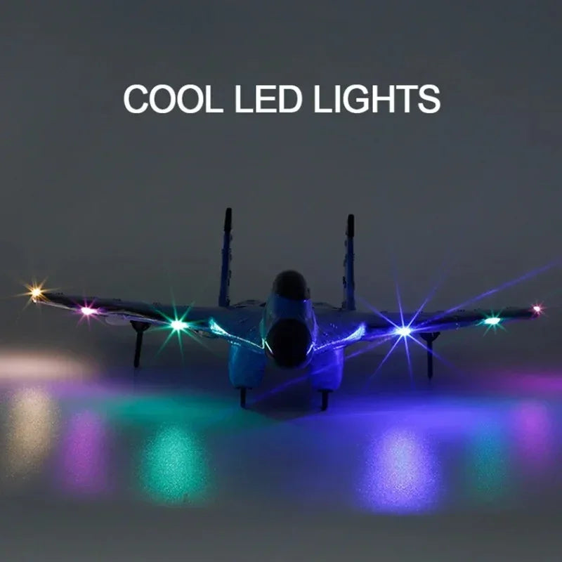 Model fighter jet with multicolored cool LED lights illuminating wings and floor in dark setting