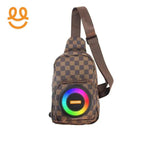 Brown checkered sling backpack with built-in colorful LED speaker on front pocket