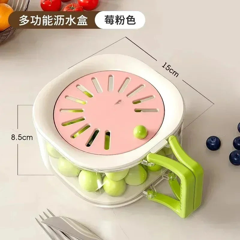 Compact multifunctional fruit washer box with pink lid and green handle filled with green grapes