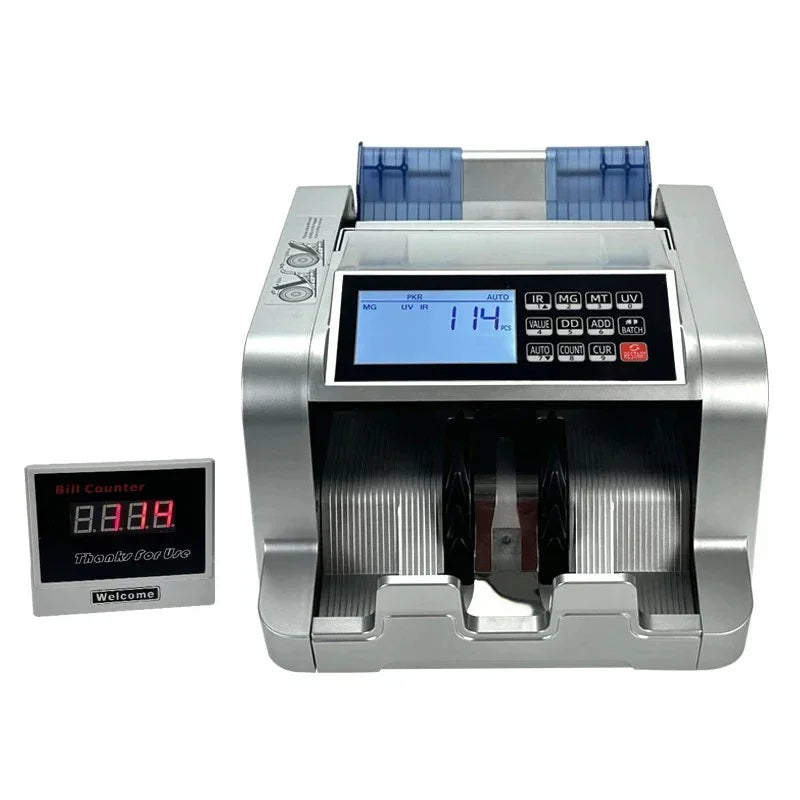 Silver electronic currency bill counter with digital display showing 114 bills counted