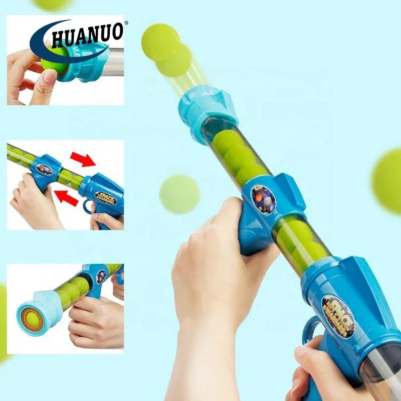 HUANUO space blaster toy shooting green foam balls with hands aiming on blue background