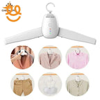 White electric clothes hanger with LED indicators and hook, shown with various garments including blazer, shirt, pants, and bra