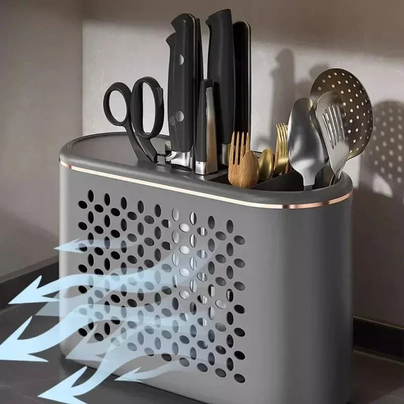 Modern gray kitchen utensil holder with knives, scissors, and cutlery, featuring ventilation holes