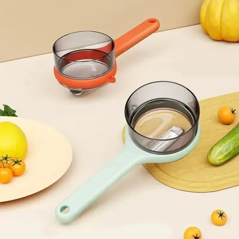 Two transparent measuring cups with pastel handles on kitchen counter, surrounded by cherry tomatoes, lemon, and cucumber
