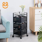 Black metal mesh rolling storage cart with three baskets, placed between light blue sofa and wooden cabinet