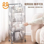 Clear plastic rolling storage cart with four baskets holding books, ceramics, and kitchenware