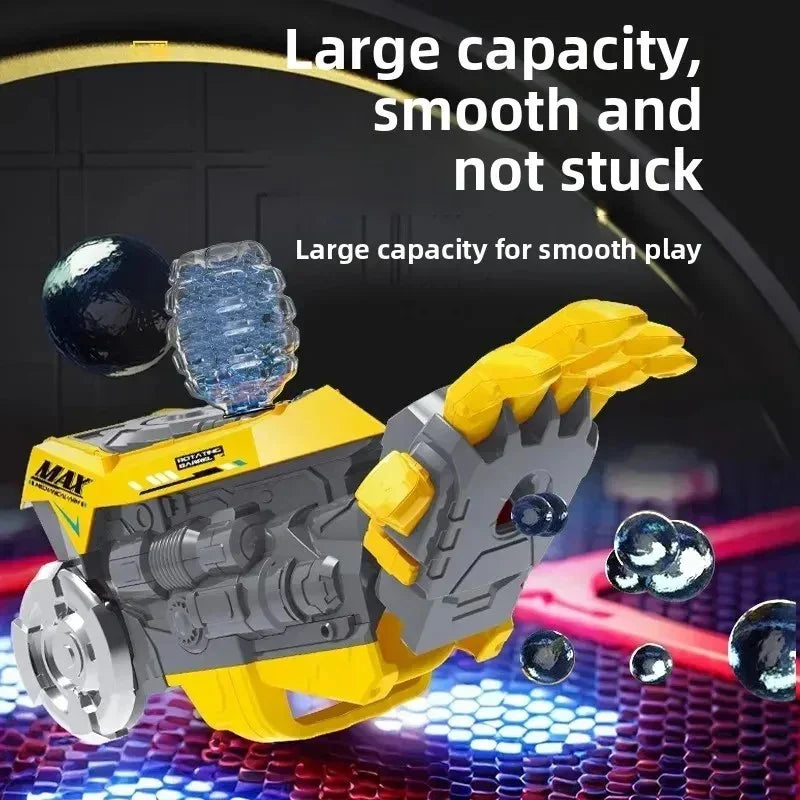 Yellow and gray mechanical toy with rotating parts and floating glossy black spheres on hexagonal surface