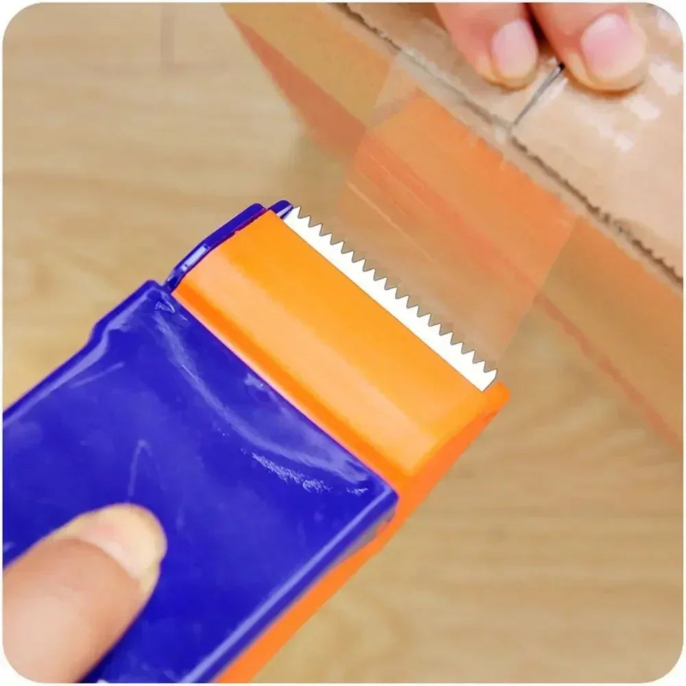 Hand using a blue and orange tape dispenser to seal a cardboard box with clear packing tape
