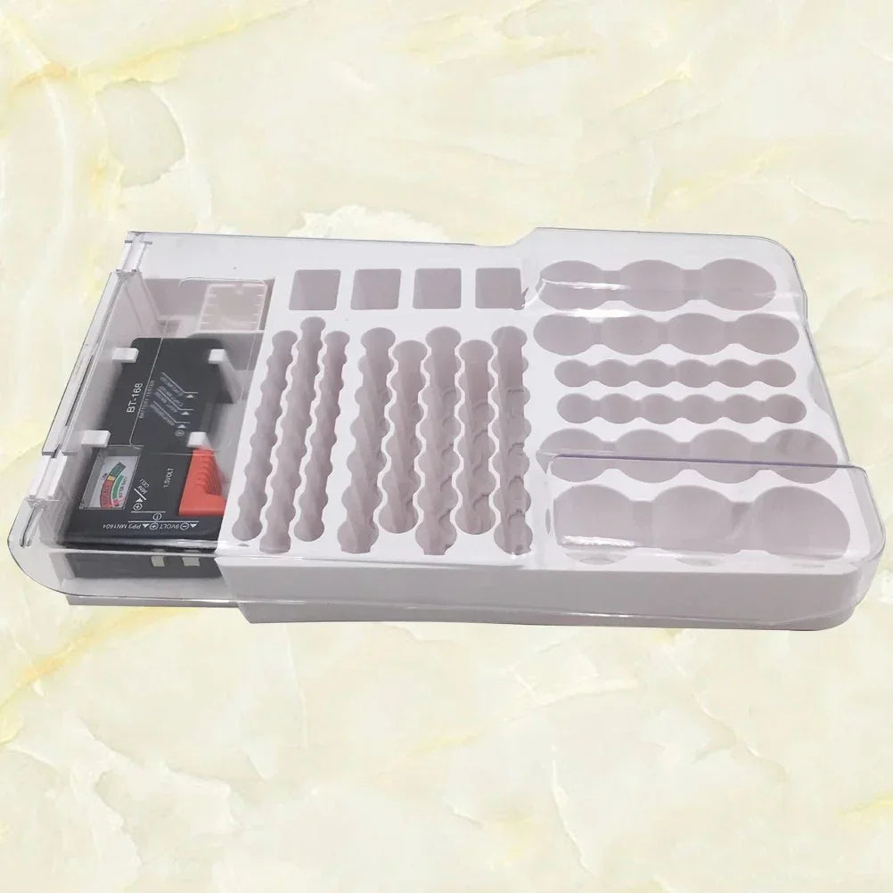 Clear plastic organizer tray with compartments and a BT-168 device on a beige marble surface